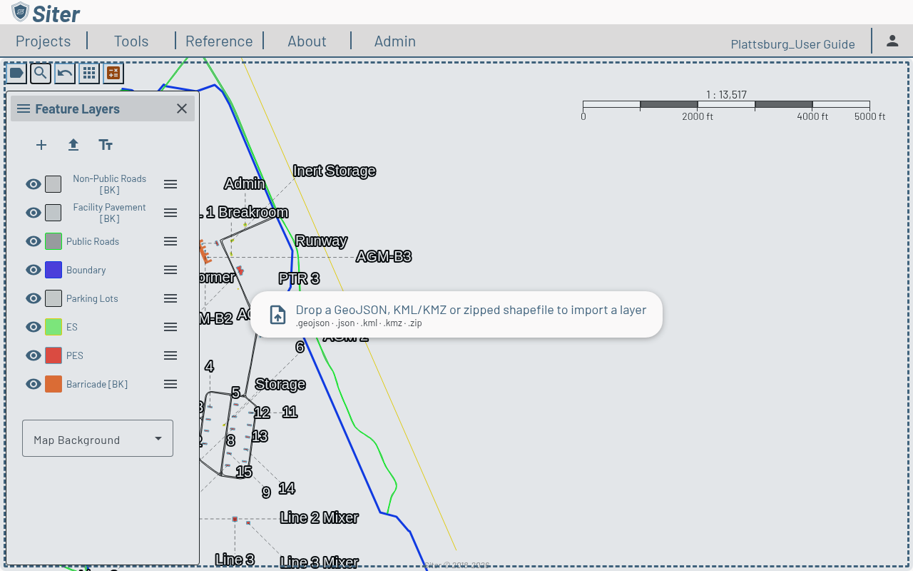 Map covered by the file-drop overlay reading Drop a GeoJSON, KML/KMZ or zipped shapefile to import a layer